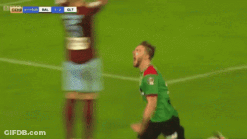 Two Soccer Players Celebrating A Goal GIF