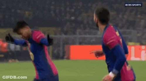 Two Soccer Players Celebrating Goal GIF