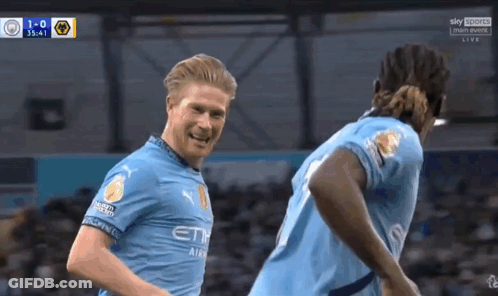 Two Soccer Players Celebrating Goal GIF