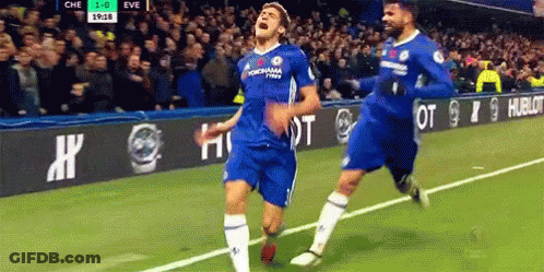 Two Soccer Players Celebrating Goal GIF