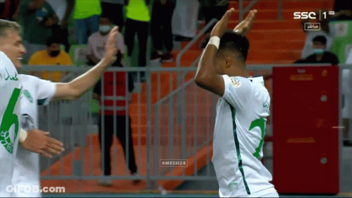 Two Soccer Players Celebrating Goal With SSC GIF