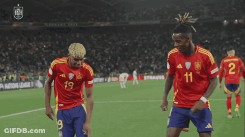 Two Soccer Players Dancing In Number 11 Jerseys GIF