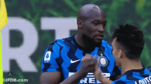 Two Soccer Players Fist Bump GIF