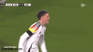 Two Soccer Players High Five During Game GIF