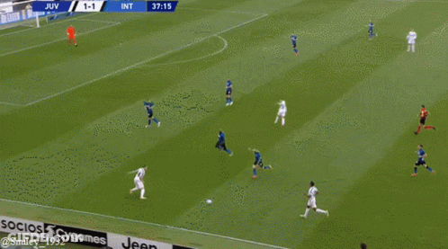 Two Soccer Players High Five On Green Background GIF