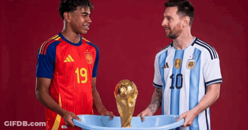 Two Soccer Players Holding A Trophy With One Wearing A Number 10 Jersey GIF