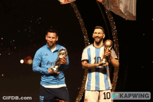Two Soccer Players Holding Trophies Number 10 GIF