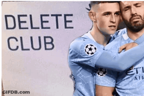 Two Soccer Players Hug In Front Of Delete Club Sign GIF