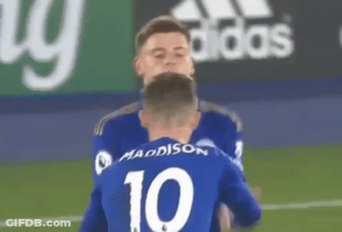Two Soccer Players Hugging GIF