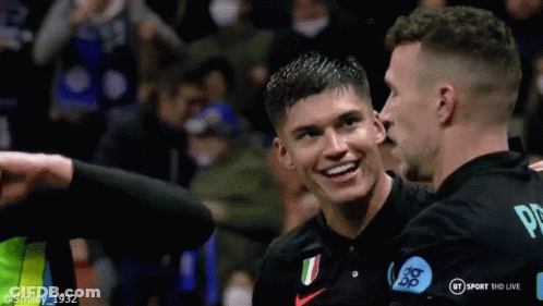Two Soccer Players Hugging And Smiling GIF