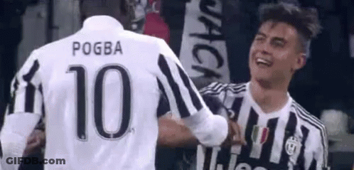 Two Soccer Players Hugging During Game GIF