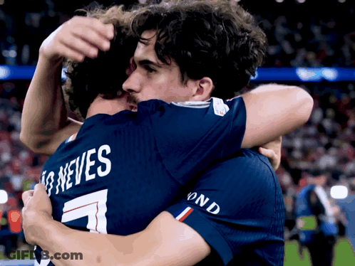 Two Soccer Players Hugging Neves Jersey GIF
