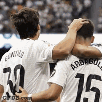 Two Soccer Players Hugging Number 15 GIF