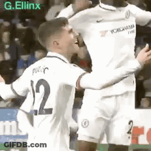 Two Soccer Players Hugging On Field GIF