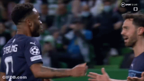 Two Soccer Players Hugging On Field GIF