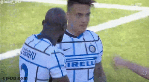 Two Soccer Players Hugging On Field GIF