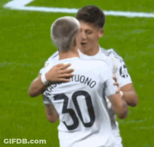 Two Soccer Players Hugging, One With Number 50 GIF