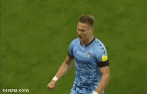 Two Soccer Players Hugging GIF