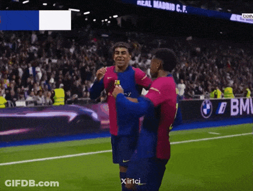Two Soccer Players Hugging Saying Xirlci GIF