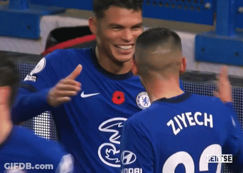 Two Soccer Players Hugging Ziyach Jersey GIF