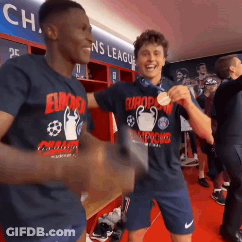 Two Soccer Players In A Locker Room Wearing Shirts That Say Europa Champions League GIF