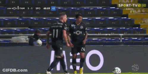 Two Soccer Players In Betan Jerseys In Tunnel GIF