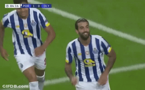 Two Soccer Players In Blue And White Striped Jerseys Are Running On A Field . GIF