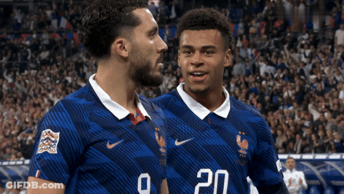 Two Soccer Players In Blue Jerseys Number 20 GIF