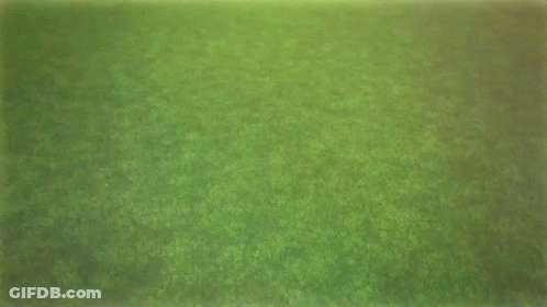 Two Soccer Players In Blue Shorts And Black Socks Walking On Field GIF