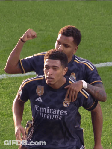 Two Soccer Players In Emirates Fly Better Jerseys Celebrate On Field GIF