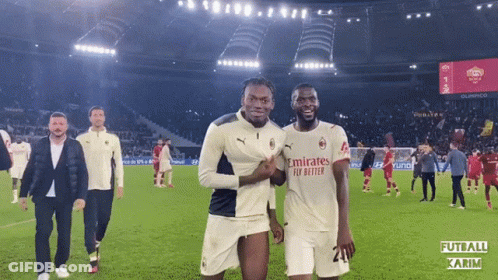 Two Soccer Players In Emirates Fly Better Jerseys Posing GIF