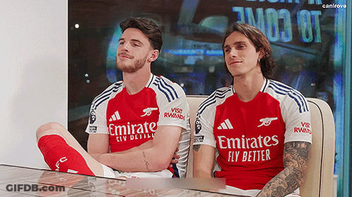 Two Soccer Players In Emirates Jerseys GIF