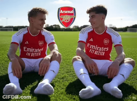 Two Soccer Players In Emirates Jerseys GIF