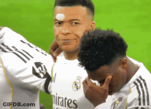 Two Soccer Players In Emirates Jerseys Hugging GIF