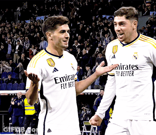 Two Soccer Players In Emirates Jerseys GIF