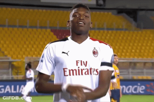 Two Soccer Players In Emirates Jerseys GIF
