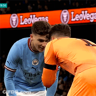 Two Soccer Players In Front Of LeoVegas Sign GIF