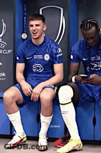 Two Soccer Players In Locker Room, One In Hyundai Shirt GIF
