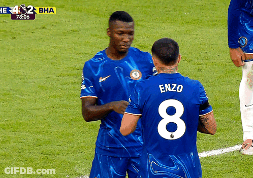 Two Soccer Players In Number 10 Jerseys Celebrating Goal GIF