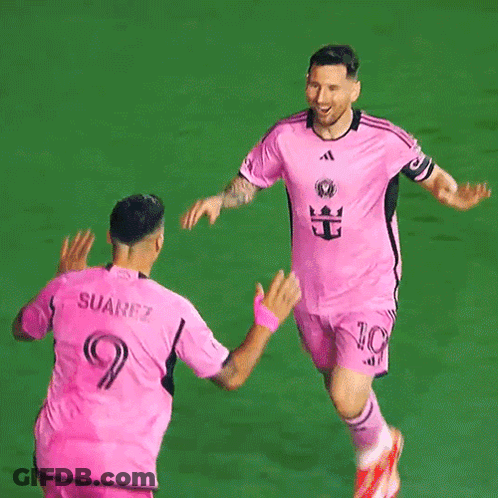 Two Soccer Players In Pink Suarez Jerseys GIF