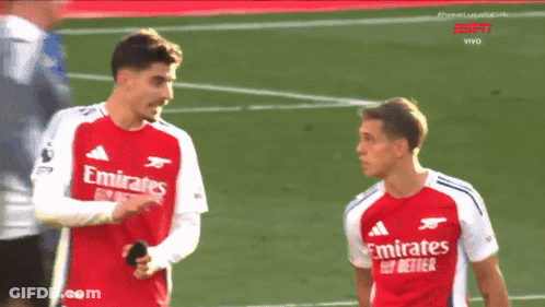 Two Soccer Players In Red Emirates Fly Better Jerseys GIF
