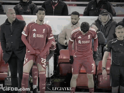 Two Soccer Players In Red Jersey Standard Chartered GIF