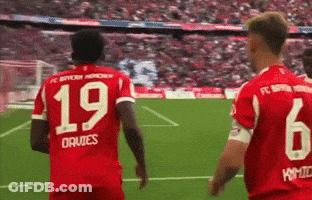 Two Soccer Players In Red Jerseys 19 And 6 GIF