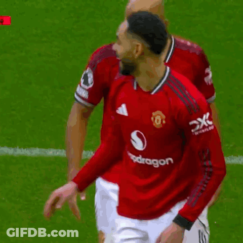 Two Soccer Players In Red Jerseys GIF