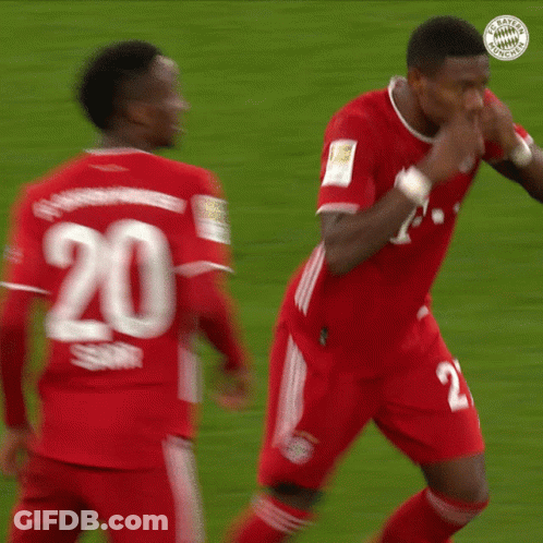 Two Soccer Players In Red Jerseys Number 20 GIF