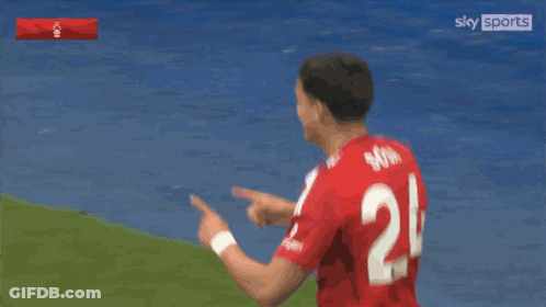 Two Soccer Players In Red Jerseys Number 7 And 24 GIF
