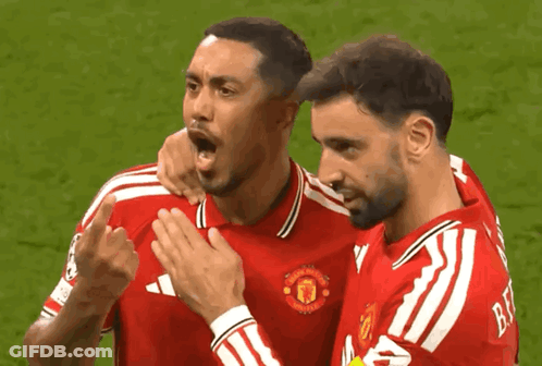 Two Soccer Players In Red Manchester Jerseys GIF