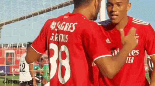 Two Soccer Players In Red Shirts Number 38 GIF