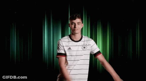 Two Soccer Players In Red Standard Chartered Jerseys GIF