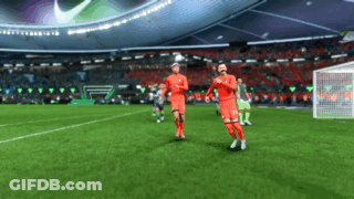 Two Soccer Players In Red Uniforms Running GIF